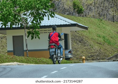 People Riding Motorcycle Without Helmet