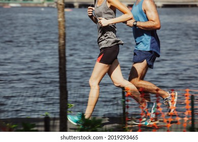 People running at Charles river Esplanade in the summer at Boston, USA.