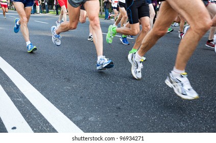 People Running Fast In A City Marathon On Street