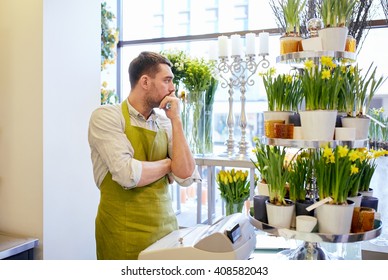 People, Sale, Retail, Business And Floristry Concept - Sad Florist Man With Cashbox Standing At Flower Shop Counter