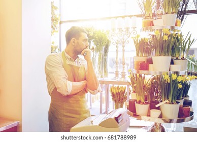 People, Sale, Retail, Business And Floristry Concept - Sad Florist Man With Cashbox Standing At Flower Shop Counter