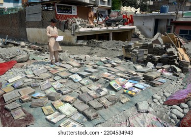 People Salvage Usable Items From A Damaged Hotel Building And Homes Caused By Floodwaters, In Kalam In Swat Valley, Pakistan, Tuesday, Aug. 30, 2022.
