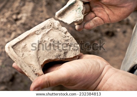 people with samples of archeology in the hands of