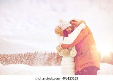 People, Season, Love And Leisure Concept - Happy Couple Hugging Outdoors In Winter