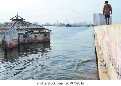 People Is Seen Around An Abandoned Mosque Who Sinking By Sea Level Rising In Jakarta, Indonesia, November 20, 2021.