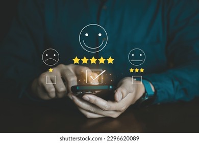 People select Five star for Feedback and Review Satisfaction on smartphone application, Service customer and testimonial.