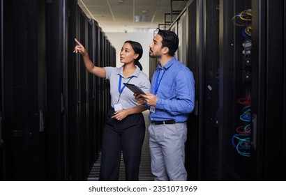 People, server room and engineering teamwork, inspection and tablet for cybersecurity, power or coding solution. Electrician man and woman or manager show or check data center with digital technology - Powered by Shutterstock - Get 15% off with code: PIKWIZARD15