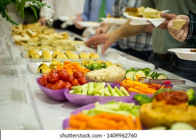 People Serving From Veggie Tray
