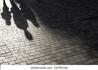 People Shadow On The Pavement