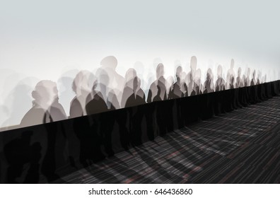 Lot Of People Shadows On White Wall In Perspective