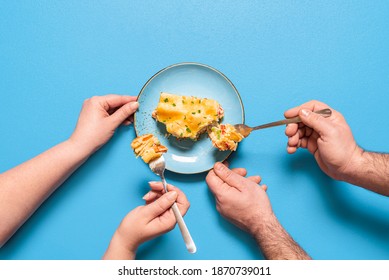 People Sharing And Eating A Slice Of Lasagna, Isolated On Blue Background. Flat Lay With Vegetable Lasagna On A Blue Plate. Homemade Italian Dinner.