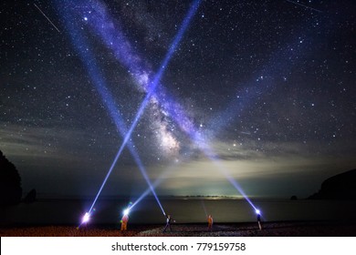 People Shine With Led Flashlights To Night Sly With Milky Way