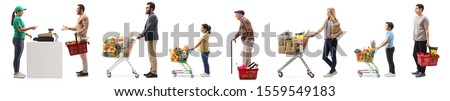 People with shopping carts and baskets waiting in line at the cash register isolated on white background