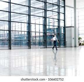 People Silhouette In Hall Of Office Building