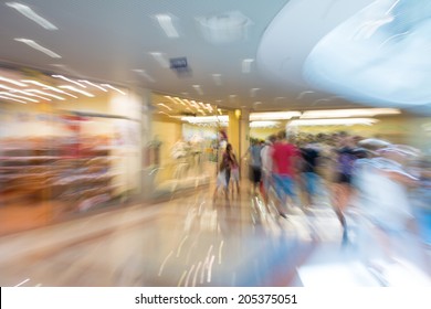 People Silhouettes At Shopping Mall In Motion Blur