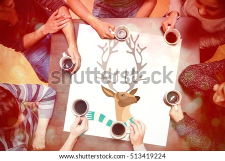 People sitting around table drinking coffee against hipster reindeer