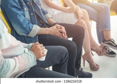 People sitting in circle, aa meeting, support group, therapy and psychiatry concept.