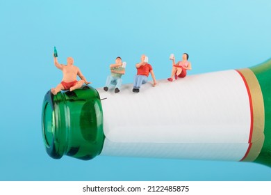 People Sitting At The Mouth Of The Wine Bottle Drink