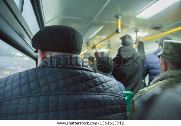 People\
sitting on a comfortable bus in Selective focus and blurred\
background. İs the main mass transit passengers in the bus. People\
in old public bus, view from inside the bus\
.