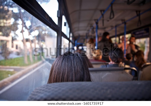 People\
sitting on a comfortable bus in Selective focus and blurred\
background. s the main mass transit passengers in the bus. People\
in old public bus, view from inside the bus\
.