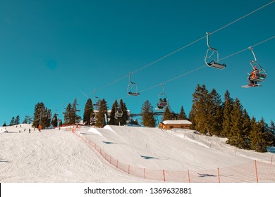 People Sitting On Ski Lift