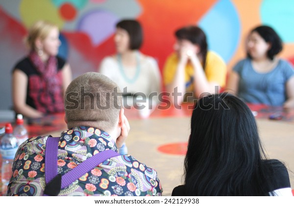People sitting at the round\
table
