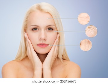 people, skin care and beauty concept - face of beautiful happy young woman over blue background