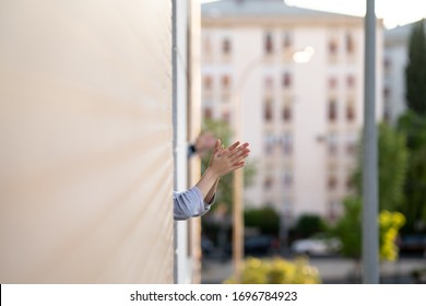 People In Spain Clapping In The Window In Support Of People Who Fight Against The Coronavirus