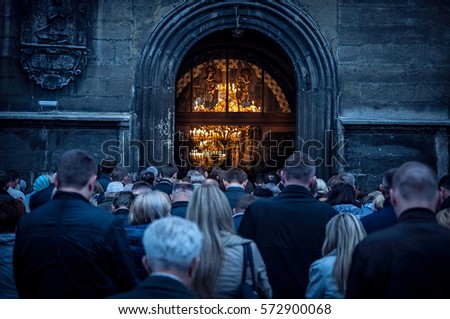 People stand outside of the church during the morning prayer