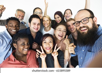 People standing in group and posing for photoshoot - Shutterstock ID 615895589