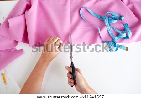 Similar – Image, Stock Photo Dressmaker cutting a cloth