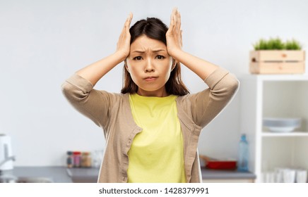 People, Stress And Cooking Concept - Stressed Asian Woman Holding To Her Head Over Kitchen Background