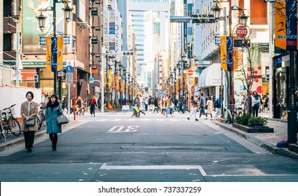 People Strolling, Relaxing In The Walking Street Of Ginza Area, Tokyo, Japan On Christmas's Day - December 2016