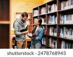 People, students and library speaking with books, happy and campus for learning or university education. Conversation, academic scholarship and collaboration, exam preparation and college thesis