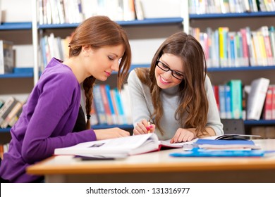 People Studying Together In A Library