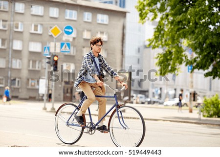 Similar – Image, Stock Photo Young man with bicycle in the sea