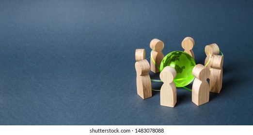 People surrounded a green Globe world planet earth. Diplomacy and crowdfunding. Concept of cooperation and collaboration of people and countries around the world. Outsourcing and joint work on project - Shutterstock ID 1483078088