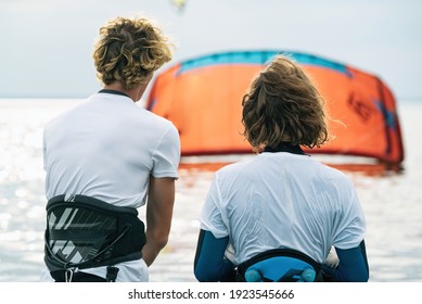 People swim in the sea on a kiteboard or kitesurfing. Summer sport learning how to kitesurf. Kite surfing on Puck bay in Jastarnia, Poland, Europe