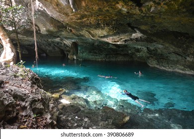 People Swimming In Dos Ojos Cenote.
This Cenote Is Located 20 Km From Tulum In Yucatan Peninsula, Mexico.
