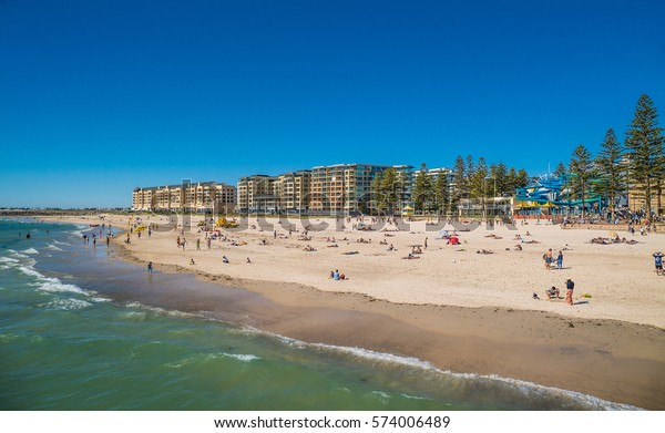 people-swimming-and-lying-in-the-sun-on-glenelg-beach-december-11th