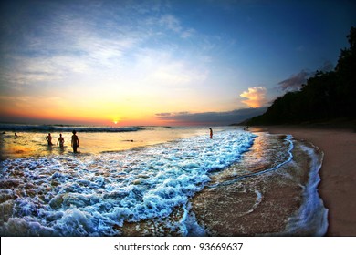 People Swimming in Ocean During Sunset in Costa Rica - Shutterstock ID 93669637
