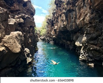 People Swimming In A Scenic Natural Pool In Santa Cruz Island, Galapagos, Ecuador