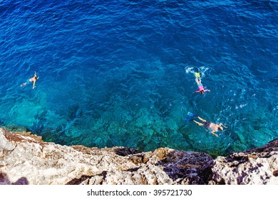 People Swimming With Snorkel At Cala Pi, Mallorca, Spain