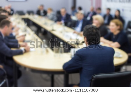 People at the table at a business meeting
