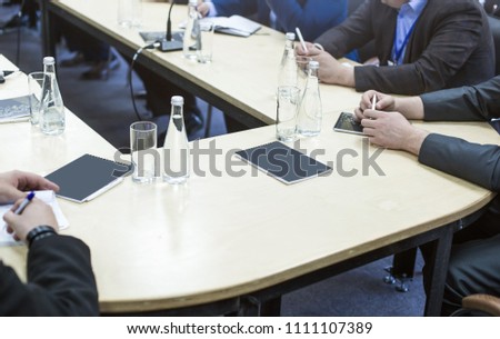 People at the table at a business meeting. Closeup