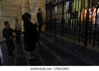 People Take Part In Easter Vigil Mass Behind Closed Doors In Catholic Church Of Sainte-Catherine In Brussels, Belgium, On Holy And Great Saturday, April 11, 2020. 