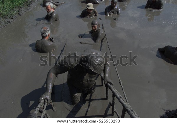 People are taking a mud bath in pikrolimni  Greece
23 june 2016