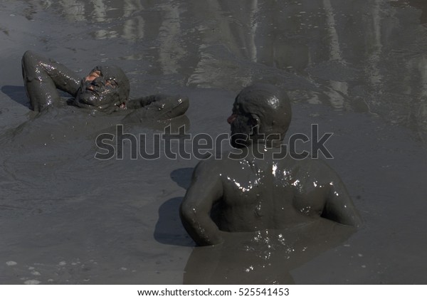 People are taking a mud bath in pikrolimni , Greece  23\
june 2016 