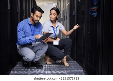 People, talking and technician in server room with tablet for cybersecurity, update or team problem solving in data or coding. Engineer, teamwork and working with error in information technology code - Powered by Shutterstock