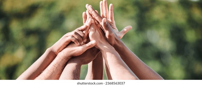 People, teamwork and high five in nature, support or collaboration for motivation or outdoor goals. Closeup of group hands together in team building, solidarity or trust in unity or community outside - Powered by Shutterstock